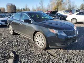 2014 Lincoln MKS EcoBoost with VIN 1LNHL9FT2EG600500, listed as a Copart auction lot 83764694 with 74,949 mi miles and Salvage title. Bid and sale history available at DreamBid. Image 4.