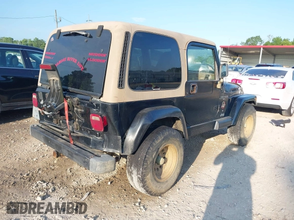 2000 Jeep Wrangler Sahara with VIN 1J4FA59SXYP718029, listed as a IAAI auction lot 42583372 with 260,811 mi miles and . Bid and sale history available at DreamBid. Image 4.