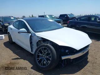 2023 Tesla Model S with VIN 5YJSA1E51PF499919, listed as a IAAI auction lot 42459166 with 6,612 mi miles and . Bid and sale history available at DreamBid. Image 6.