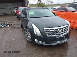 2014 Cadillac XTS Luxury z VIN 2G61N5S3XE9263574, wystawiony jako IAAI lot #41956630 z przebiegiem 150 225 mil mil oraz . Historia ofert i sprzedaży dostępna na DreamBid. Obrazek 1.
