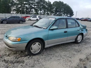 1999 Toyota Corolla VE with VIN 2T1BR12E0XC126940, listed as a Copart auction lot 60268715 with Not provided miles and Salvage title. Bid and sale history available at DreamBid. Image 1.