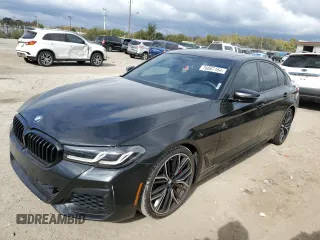 2021 BMW 5 Series M550i xDrive z VIN WBA13BK06MCF80945, wystawiony jako Copart lot #76067164 z przebiegiem 49 669 mil mil oraz Szkoda całkowita • Salvage title. Historia ofert i sprzedaży dostępna na DreamBid. Obrazek 1.