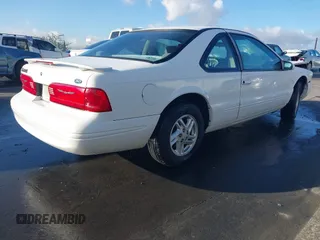 1996 Ford Thunderbird LX with VIN 1FALP6240TH185576, listed as a IAAI auction lot 41493910 with 100,880 mi miles and . Bid and sale history available at DreamBid. Image 4.