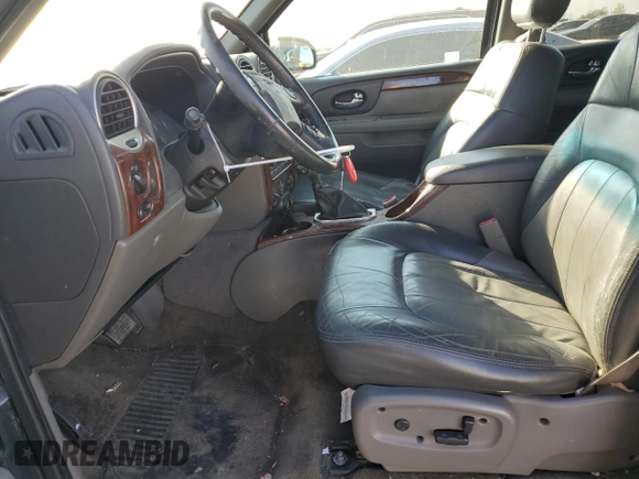 2002 GMC Envoy SLE with VIN 1GKDS13S022512481, listed as a Copart auction lot 74701454 with 0 mi miles and Salvage Title. Bid and sale history available at carsss.com. Image 7.