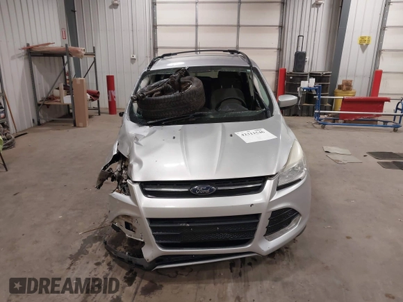 2013 Ford Escape SE with VIN 1FMCU9GX7DUB89197, listed as a IAAI auction lot 42311546 with 131,263 mi miles and . Bid and sale history available at DreamBid. Image 13.
