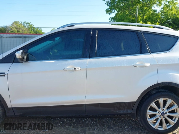 2017 Ford Escape Titanium with VIN 1FMCU0J90HUC51244, listed as a IAAI auction lot 42206165 with 106,847 mi miles and . Bid and sale history available at DreamBid. Image 14.