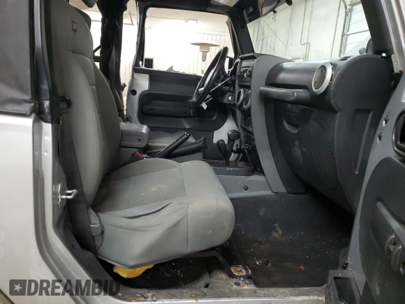 2009 Jeep Wrangler Sahara z VIN 1J4FA54189L789642, wystawiony jako Copart lot #89078145 z przebiegiem 128 902 mil mil oraz Szkoda całkowita • Salvage title. Historia ofert i sprzedaży dostępna na DreamBid. Obrazek 7.