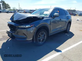 2019 Mazda CX-5 Touring with VIN JM3KFACM1K0533142, listed as a IAAI auction lot 41880181 with Not Provided miles and . Bid and sale history available at carsss.com. Image 2.