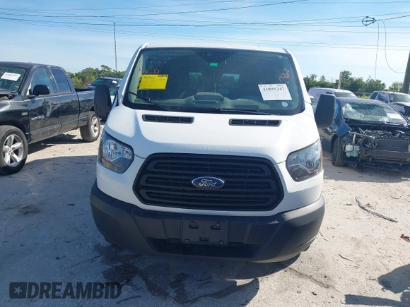 2019 Ford Transit z VIN 1FTYR2ZM1KKB25574, wystawiony jako IAAI lot #41891247 z przebiegiem 142 627 mil mil oraz . Historia ofert i sprzedaży dostępna na DreamBid. Obrazek 12.