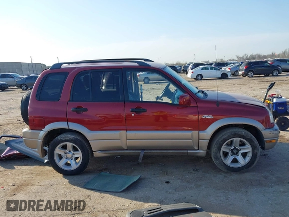 2002 Suzuki Grand Vitara JLX z VIN JS3TD62V824152943, wystawiony jako IAAI lot #41668395 z przebiegiem 104 191 mil mil oraz . Historia ofert i sprzedaży dostępna na DreamBid. Obrazek 14.
