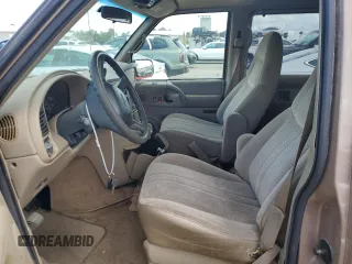 2000 GMC Safari with VIN 1GKDM19W7YB523894, listed as a Copart auction lot 74996334 with Not Provided miles and Salvage Title. Bid and sale history available at carsss.com. Image 7.