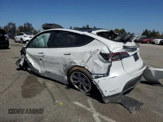 2023 Tesla Model Y Long Range z VIN 7SAYGDEE3PA077841, wystawiony jako Copart lot #54535215 z przebiegiem Nie podano mil oraz Szkoda całkowita • Salvage title. Historia ofert i sprzedaży dostępna na DreamBid. Obrazek 2.