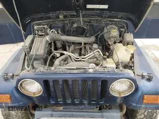 2000 Jeep Wrangler Sport z VIN 1J4FA49S1YP713523, wystawiony jako Copart lot #58076745 z przebiegiem 117 112 mil mil oraz Czysty tytuł • Clean title. Historia ofert i sprzedaży dostępna na DreamBid. Obrazek 11.