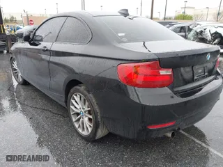 2014 BMW 2 Series 228i with VIN WBA1F5C57EV256067, listed as a IAAI auction lot 41283608 with 108,128 mi miles. Bid and sale history available at carsss.com. Image 3.