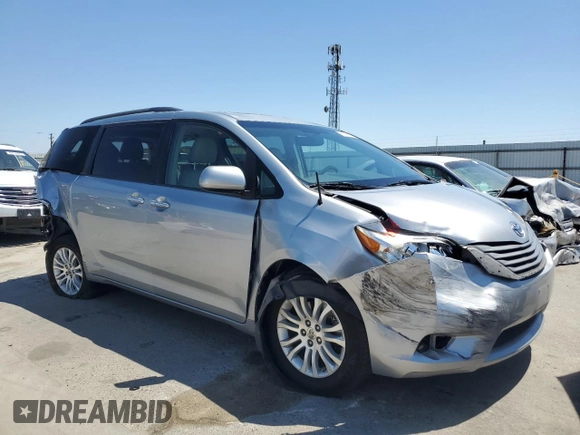 2014 Toyota Sienna XLE with VIN 5TDYK3DCXES496657, listed as a Copart auction lot 60498015 with 178,486 mi miles and Salvage title. Bid and sale history available at DreamBid. Image 4.