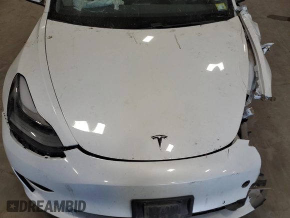 2021 Tesla Model 3 Standard Range Plus z VIN 5YJ3E1EA7MF986964, wystawiony jako Copart lot #55119995 z przebiegiem Nie podano mil oraz Szkody całkowita. Historia ofert i sprzedaży dostępna na DreamBid. Obrazek 11.