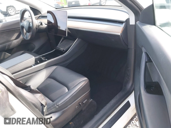 2021 Tesla Model Y Standard Range with VIN 5YJYGDED9MF110697, listed as a IAAI auction lot 41707730 with Not Provided miles and . Bid and sale history available at carsss.com. Image 5.