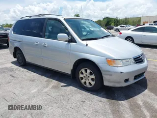 2002 Honda Odyssey EX-L with VIN 5FNRL18932B050659, listed as a IAAI auction lot 42696354 with 242,014 mi miles and . Bid and sale history available at DreamBid. Image 1.