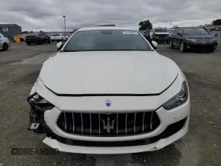 2018 Maserati Ghibli z VIN ZAM57XSA9J1271727, wystawiony jako Copart lot #52155305 z przebiegiem 62 081 mil mil oraz Szkoda całkowita • Salvage title. Historia ofert i sprzedaży dostępna na DreamBid. Obrazek 5.