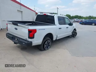 2023 Ford F-150 Lightning Pro with VIN 1FTVW1EL2PWG18764, listed as a IAAI auction lot 41908278 with 16,276 mi miles and . Bid and sale history available at DreamBid. Image 4.