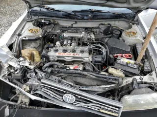 1991 Toyota Corolla z VIN 1NXAE94A8MZ234510, wystawiony jako Copart lot #75002404 z przebiegiem 188 051 mil mil oraz Szkoda całkowita • Salvage title. Historia ofert i sprzedaży dostępna na DreamBid. Obrazek 11.