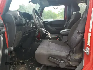 2012 Jeep Wrangler Unlimited Sport z VIN 1C4BJWDG0CL272440, wystawiony jako Copart lot #56044005 z przebiegiem 143 117 mil mil oraz Szkoda całkowita • Salvage title. Historia ofert i sprzedaży dostępna na DreamBid. Obrazek 7.