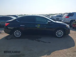 2019 Nissan Sentra S z VIN 3N1AB7AP3KY218433, wystawiony jako IAAI lot #42049945 z przebiegiem 108 874 mil mil oraz . Historia ofert i sprzedaży dostępna na DreamBid. Obrazek 13.