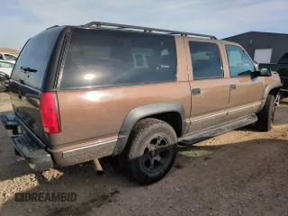 1998 GMC Suburban z VIN 3GKFK16R4WG507685, wystawiony jako Copart lot #87900735 z przebiegiem 183 033 mil mil oraz Szkoda całkowita • Salvage title. Historia ofert i sprzedaży dostępna na DreamBid. Obrazek 3.