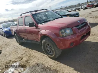 2003 Nissan Frontier XE with VIN 1N6ED27T13C409632, listed as a Copart auction lot 84884434 with 194,167 mi miles and Salvage title. Bid and sale history available at DreamBid. Image 4.