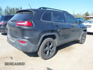 2015 Jeep Cherokee North with VIN 1C4PJMCS3FW777973, listed as a IAAI auction lot 42043203 with 158,536 mi miles. Bid and sale history available at carsss.com. Image 4.