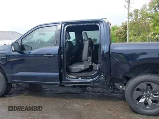 2023 Ford F-150 Lightning Pro with VIN 1FTVW1EL7PWG11924, listed as a IAAI auction lot 41991819 with 20,450 mi miles and . Bid and sale history available at DreamBid. Image 15.