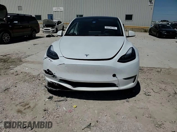 2023 Tesla Model Y Long Range z VIN 7SAYGDEE1PA155629, wystawiony jako Copart lot #52234735 z przebiegiem 24 944 mil mil oraz Szkoda całkowita • Salvage title. Historia ofert i sprzedaży dostępna na DreamBid. Obrazek 11.