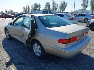 2001 Toyota Camry CE with VIN JT2BG22KX10559757, listed as a IAAI auction lot 41823719 with 72,775 mi miles. Bid and sale history available at carsss.com. Image 3.
