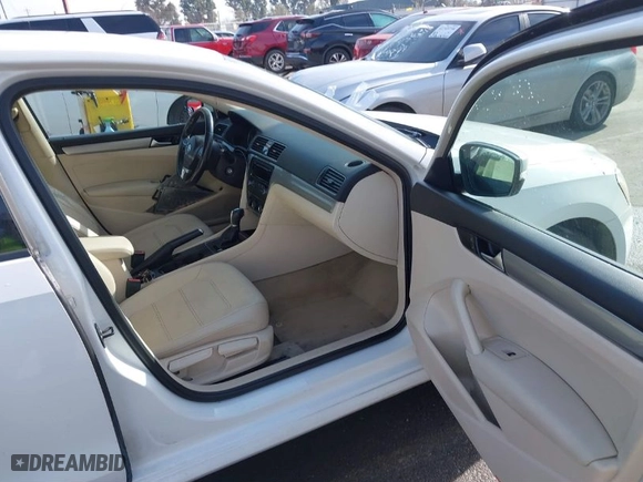 2014 Volkswagen Passat Wolfsburg Ed with VIN 1VWAT7A30EC097331, listed as a IAAI auction lot 41762061 with 173,351 mi miles. Bid and sale history available at carsss.com. Image 5.