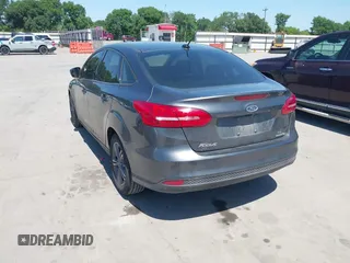 2018 Ford Focus SE with VIN 1FADP3FE3JL204220, listed as a IAAI auction lot 41972960 with 62,682 mi miles and . Bid and sale history available at DreamBid. Image 3.