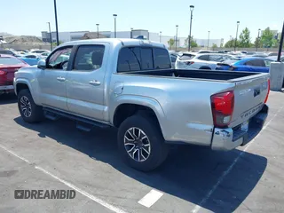 2022 Toyota Tacoma SR with VIN 3TYAX5GN4NT037625, listed as a IAAI auction lot 42382411 with 49,703 mi miles and . Bid and sale history available at DreamBid. Image 3.