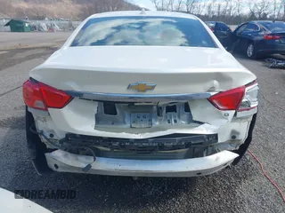 2014 Chevrolet Impala LT with VIN 1G1125S33EU101464, listed as a IAAI auction lot 41863521 with 215,270 mi miles and . Bid and sale history available at DreamBid. Image 6.