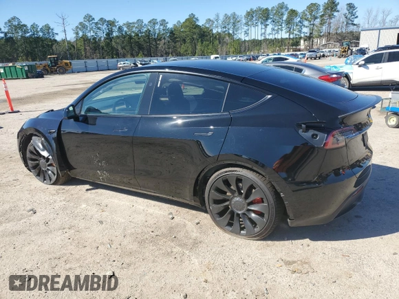 2023 Tesla Model Y Performance with VIN 7SAYGDEF2PF828973, listed as a Copart auction lot 45276585 with 15,750 mi miles and Salvage Title. Bid and sale history available at DreamBid. Image 2.