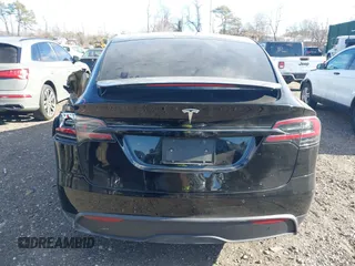 2023 Tesla Model X with VIN 7SAXCAE59PF377408, listed as a IAAI auction lot 41176738 with 32,496 mi miles and . Bid and sale history available at DreamBid. Image 16.