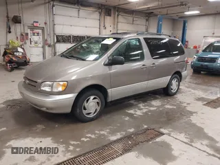 1999 Toyota Sienna LE z VIN 4T3ZF13CXXU127488, wystawiony jako IAAI lot #42334323 z przebiegiem 247 917 mil mil oraz . Historia ofert i sprzedaży dostępna na DreamBid. Obrazek 2.