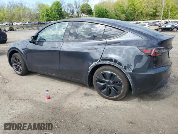 2025 Tesla Model Y Long Range with VIN 7SAYGDED7SF320702, listed as a Copart auction lot 54655325 with 1,169 mi miles and Salvage Title. Bid and sale history available at DreamBid. Image 2.