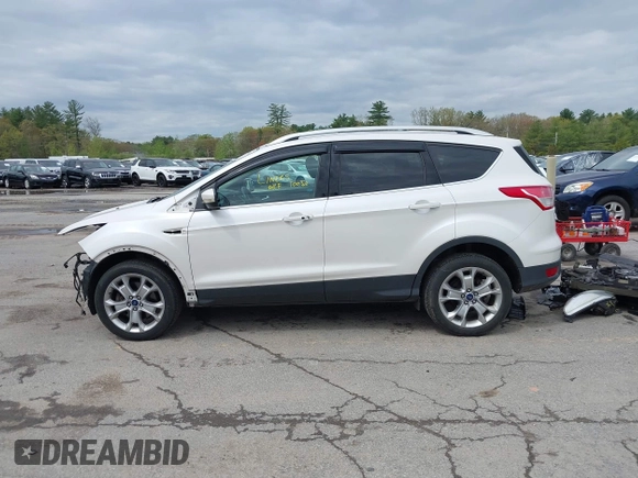 2016 Ford Escape Titanium with VIN 1FMCU9J98GUA00832, listed as a IAAI auction lot 42188941 with 90,764 mi miles and . Bid and sale history available at DreamBid. Image 14.