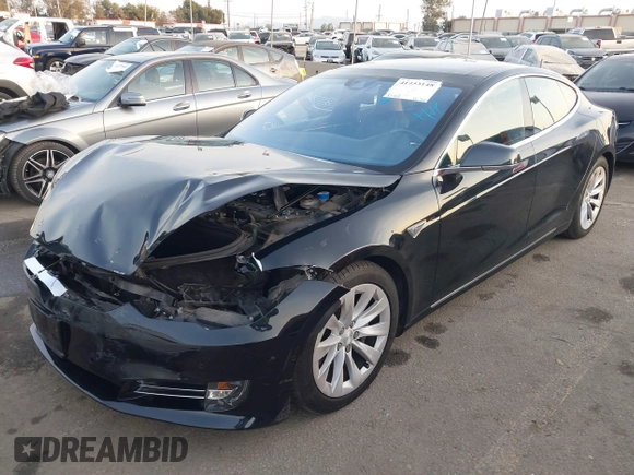 2016 Tesla Model S 90D z VIN 5YJSA1E26GF156108, wystawiony jako IAAI lot #41453148 z przebiegiem 74 717 mil mil oraz . Historia ofert i sprzedaży dostępna na DreamBid. Obrazek 21.
