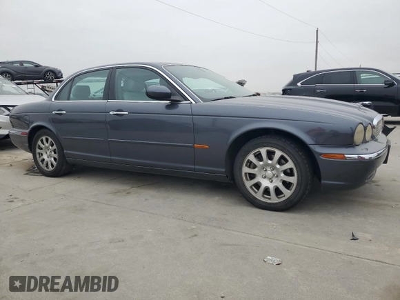 2004 Jaguar XJ with VIN SAJWA71C04SG22878, listed as a Copart auction lot 44383205 with 127,515 mi miles and Clean Title. Bid and sale history available at carsss.com. Image 4.