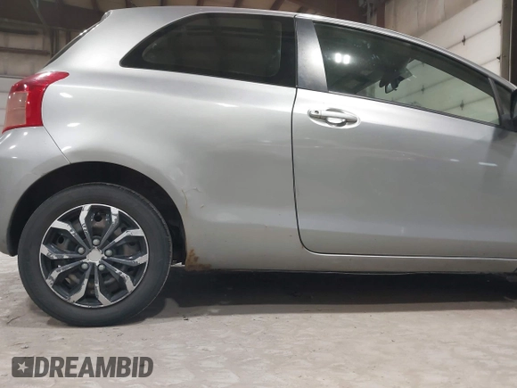 2008 Toyota Yaris with VIN JTDJT923085171725, listed as a IAAI auction lot 42090252 with 242,092 mi miles. Bid and sale history available at carsss.com. Image 6.