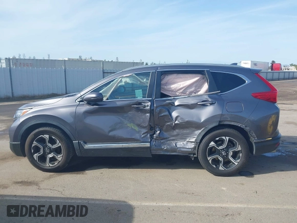 2018 Honda CR-V Touring with VIN 7FARW1H93JE027294, listed as a IAAI auction lot 41903484 with 80,999 mi miles and . Bid and sale history available at DreamBid. Image 15.