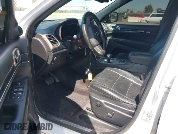 2015 Jeep Grand Cherokee Overland with VIN 1C4RJFCG3FC230185, listed as a IAAI auction lot 42494650 with 123,128 mi miles and . Bid and sale history available at DreamBid. Image 5.