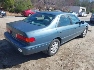 2000 Toyota Camry CE with VIN 4T1BG22KXYU730531, listed as a IAAI auction lot 42003342 with 248,235 mi miles. Bid and sale history available at carsss.com. Image 4.