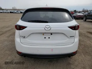 2021 Mazda CX-5 Grand Touring with VIN JM3KFBDM7M1122281, listed as a Copart auction lot 54576485 with 93,008 mi miles and Salvage Title. Bid and sale history available at DreamBid. Image 6.