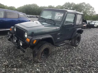 2002 Jeep Wrangler Sport z VIN 1J4FA49S12P755942, wystawiony jako Copart lot #59993245 z przebiegiem 283 819 mil mil oraz Czysty tytuł • Clean title. Historia ofert i sprzedaży dostępna na DreamBid. Obrazek 1.